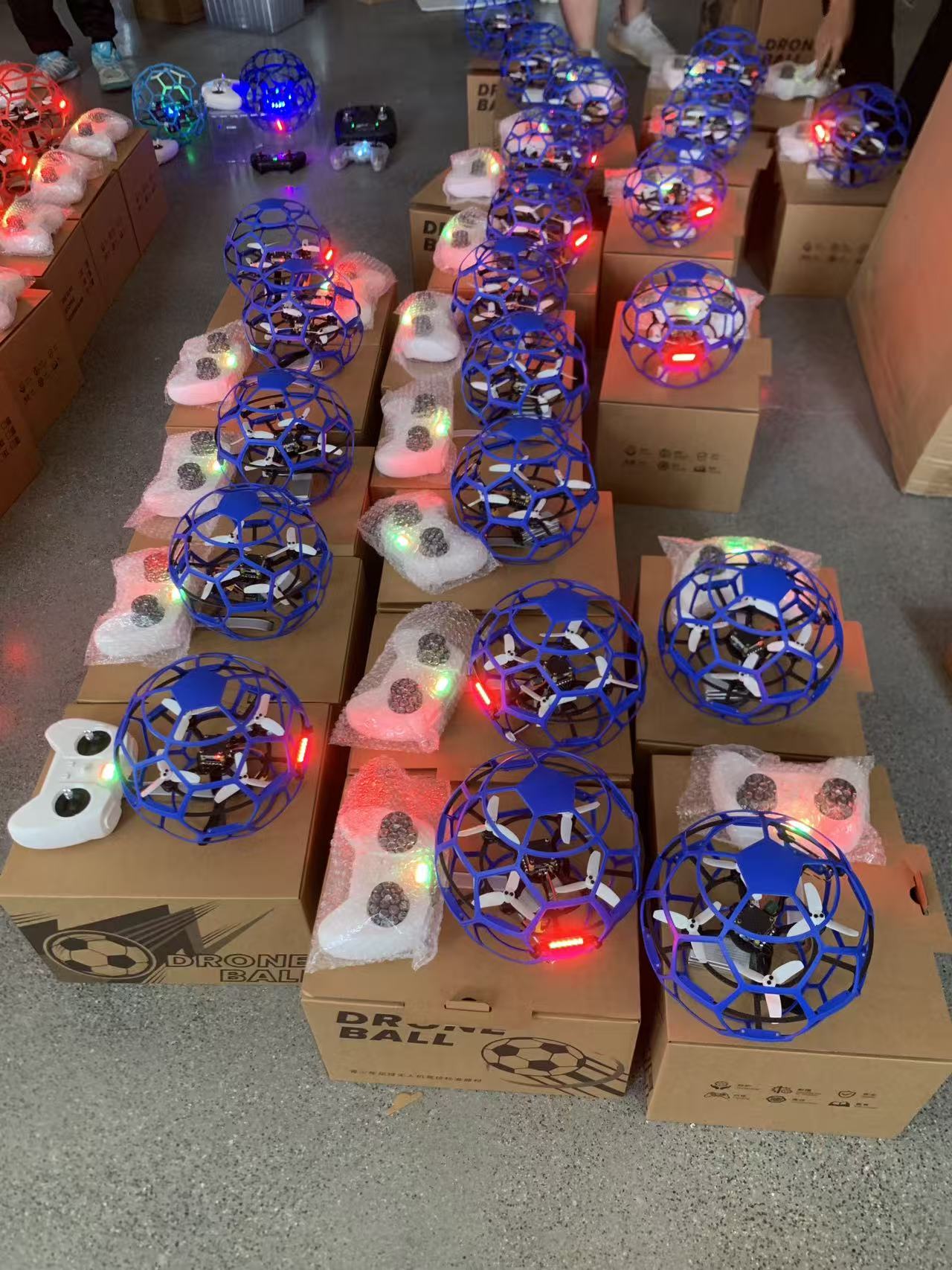 Protective-cage drones arranged for batch production